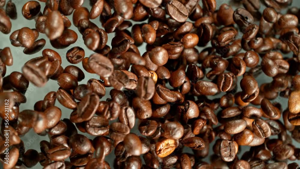 Poster super slow motion of rotating coffee beans on black background. filmed on high speed cinema camera, 
