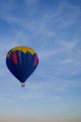 Fototapeta premium Blue air balloon flying in the clear blue sky. High quality photo - generative ai