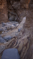 Colorful rock formations on the hiking trail in the canyon of Wadi Ghuweir in Dana in Jordan in the month of January