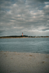 beach and sea and a lighthouse