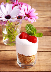granola, whipped cream and raspberry