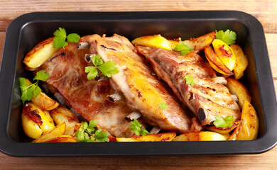Roast pork ribs with potatoes