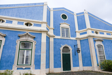 Typical vintage portuguese facade with white windows
