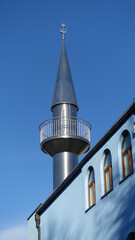 The minaret tower of a mosque where the muezzin calls to prayer 5 times a day