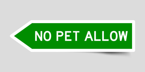 Green color arrow shape sticker label with word no pet allow on gray background