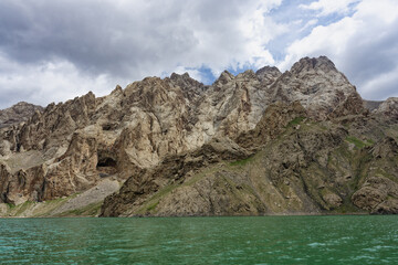 Fototapeta na wymiar Rock formation around the alpine Köl-Suu lake, Kurumduk valley, Naryn province, Kyrgyzstan