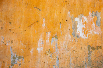 Abstract background. Closeup fragment of cracked and peeling painted wall.	
