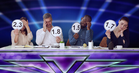 Disappointed Judges Showing Low Score Cards