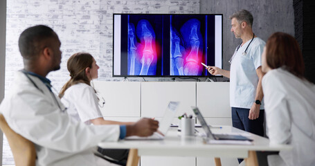 Doctors And Radiologists Discussing X-ray Images