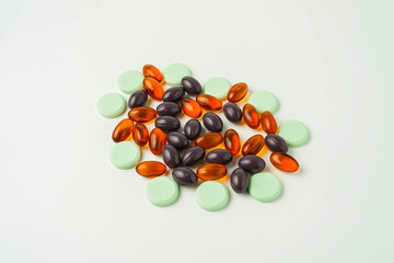 Many different tablet pills on white background, flat lay, with copy space.