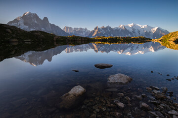The reflection of the Mont Blanc massif in the clear waters of the Lacs des Chéserys lake,...