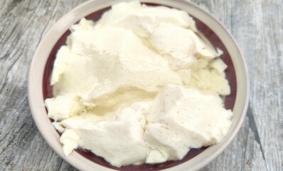 Douhua is a Chinese sweet or savoury snack made with very tender tofu.