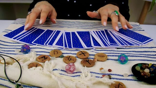 Fortune teller woman reads tarot cards. Selective focus.