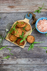 Home made  oven baked  mini  Chicken and vegetable meatballs   on  wooden background