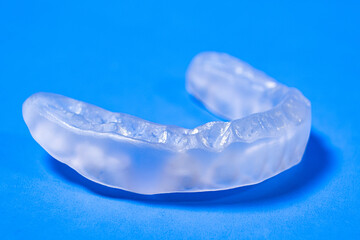 Dental mouthguard, splint for the treatment of dysfunction of the temporomandibular joints, bruxism, malocclusion, to relax the muscles of the jaw. - obrazy, fototapety, plakaty