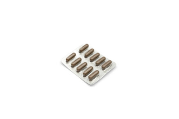 Blister pack with brown tablets isolated on a white background