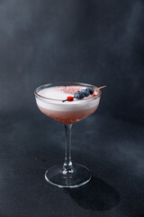 the bartender prepares a delicious alcoholic cocktail	