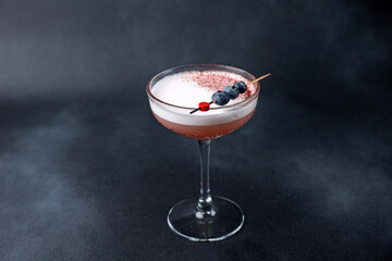 the bartender prepares a delicious alcoholic cocktail	