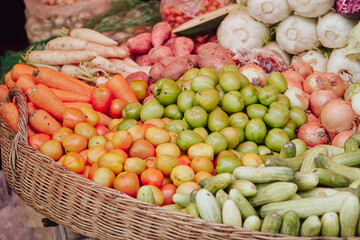 Naklejka na ściany i meble Fresh vegetables on display in a traditional market 