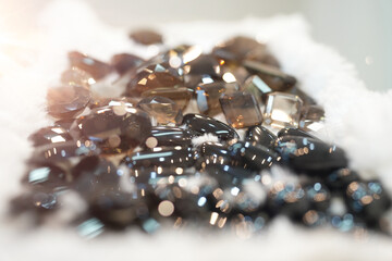 close up genuine mined natural smoky quartz gemstone and black onyx in round diamond, square, pear,...