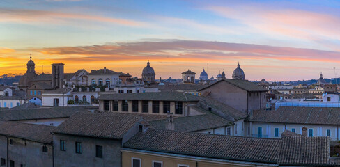 Night view at St. Peter's cathedral in Rome with reflection on Tiber river