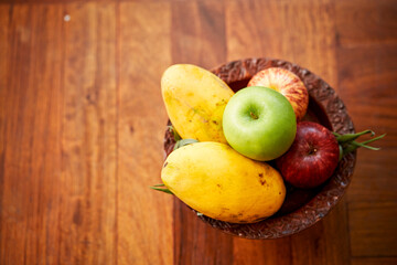 Apples and mango in a basket