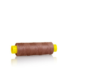 skein of thread brown colors macro on a white background