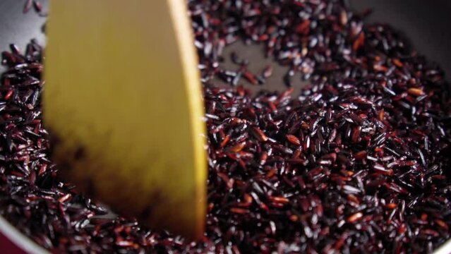 Black rice is a range of rice types of the species Oryza sativa. Cooking. Slow motion