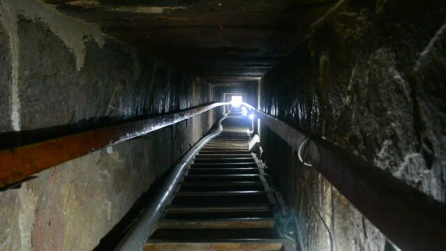 Narrow passge leading to the burial chamber inside the red north pyramid of Dahshur of king Sneferu, named for the rusty reddish hue of its red limestone stones, also called the bat pyramid