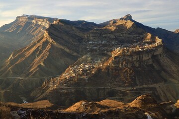 View of the ancient Dagestan village of Gunib, located high on the top of the Gunib plateau, in the evening.