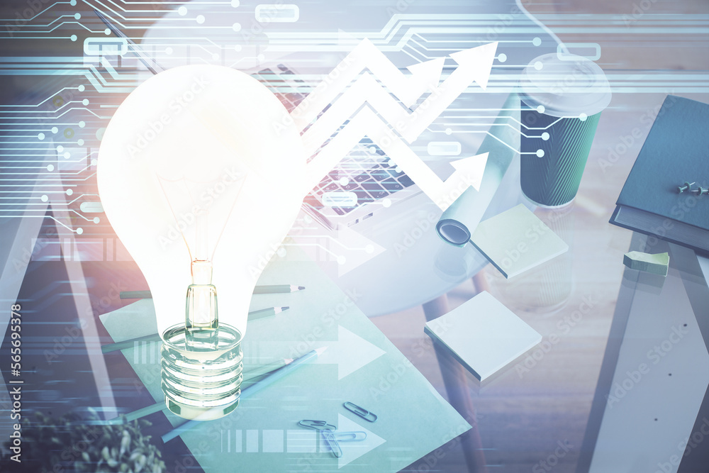 Poster computer on desktop in office with bulb icon hologram. double exposure. concept of idea.