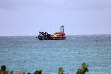 A salt water dredge is setting up offshore to dredge sand from the ocean floor off Singer Island, Florida.