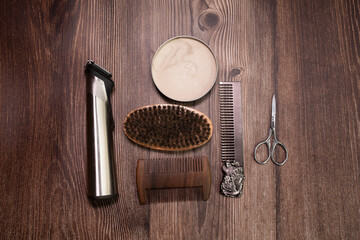 Different combs, brush and other tools for grooming a beard. Close up view. 