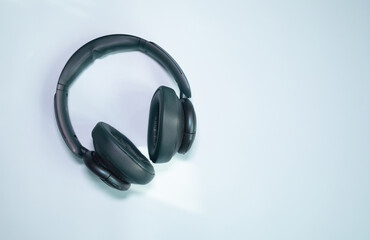 Fototapeta na wymiar Blue headphones on blue background.