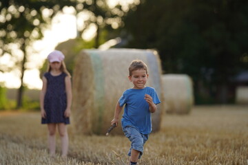 Kids running in the park together 6 and 7 years old, diversity looking, boys and girls running together. Selective focus