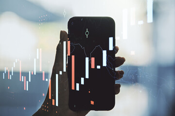 Multi exposure of abstract financial diagram and hand with cellphone on background, banking and accounting concept