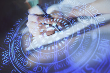 Double exposure of woman's hands on background with technology and digital coding icons. Data development concept. Close up.