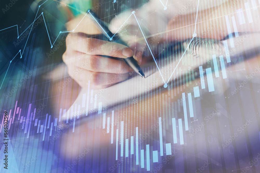 Poster financial forex graph displayed on hands taking notes background. concept of research. double exposu