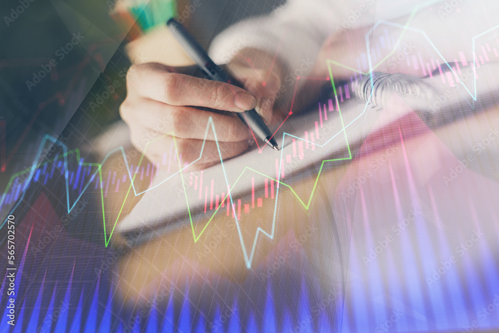 Poster financial forex graph displayed on hands taking notes background. concept of research. double exposu