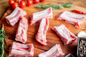 raw pork ribs on wooden background