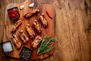 grilled pork ribs on wooden background 