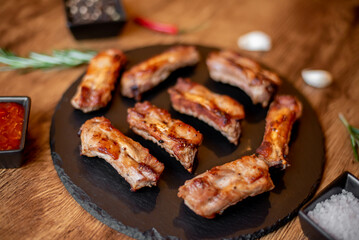 grilled pork ribs on wooden background 