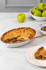 apple pie on white kitchen table