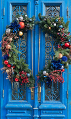 Vintage blue door with christmas wreath decoration