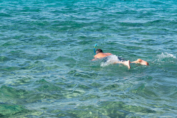 Man snorkeling with mask in Red sea, Egypt