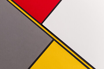 Diagonally divided red, white, gray and yellow background