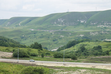 Beautiful panoramic landscape a turn of the road among green hills and cloudy sky in Kislovodsk Stavropol territory and a space for copying