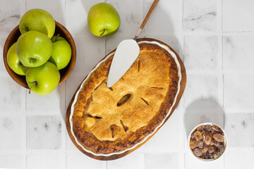 apple pie on white kitchen table top view