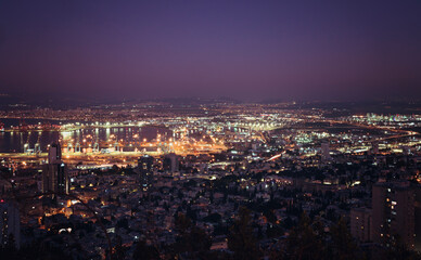 Fototapeta na wymiar Beautiful panorama of the evening city.Haifa at sunset, long exposure, Israel