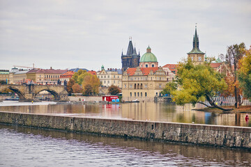 The Bedrich Smetana Museum in Prague in autumn. View from the other side of the river Vltava. - obrazy, fototapety, plakaty